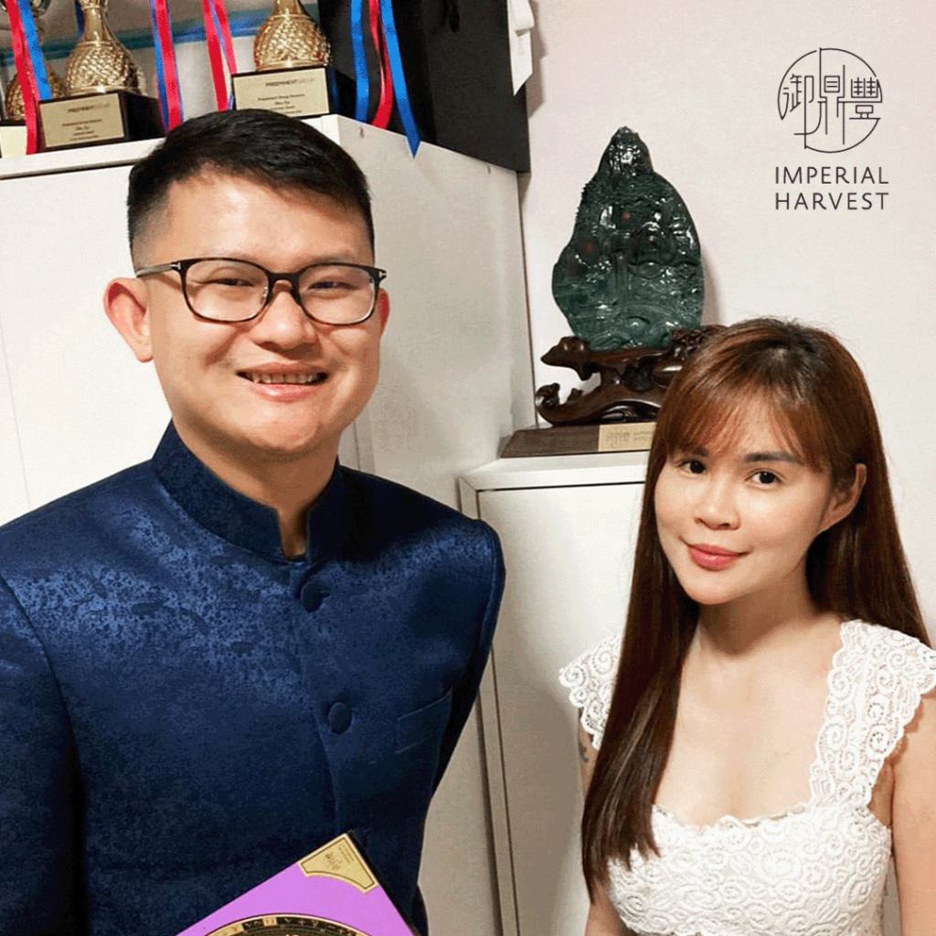 Master David posing with one of Imperial Harvest's clients after her Qian Long Jadeite Mountain installation.