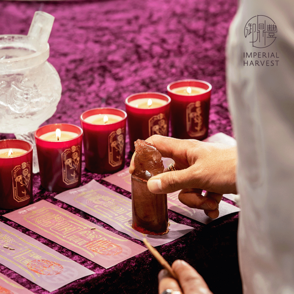 Master David stamping talismans during ceremony