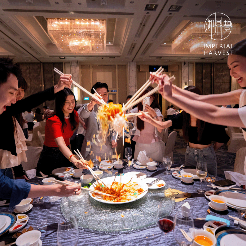 Imperial Harvest guests participating in the lo hei