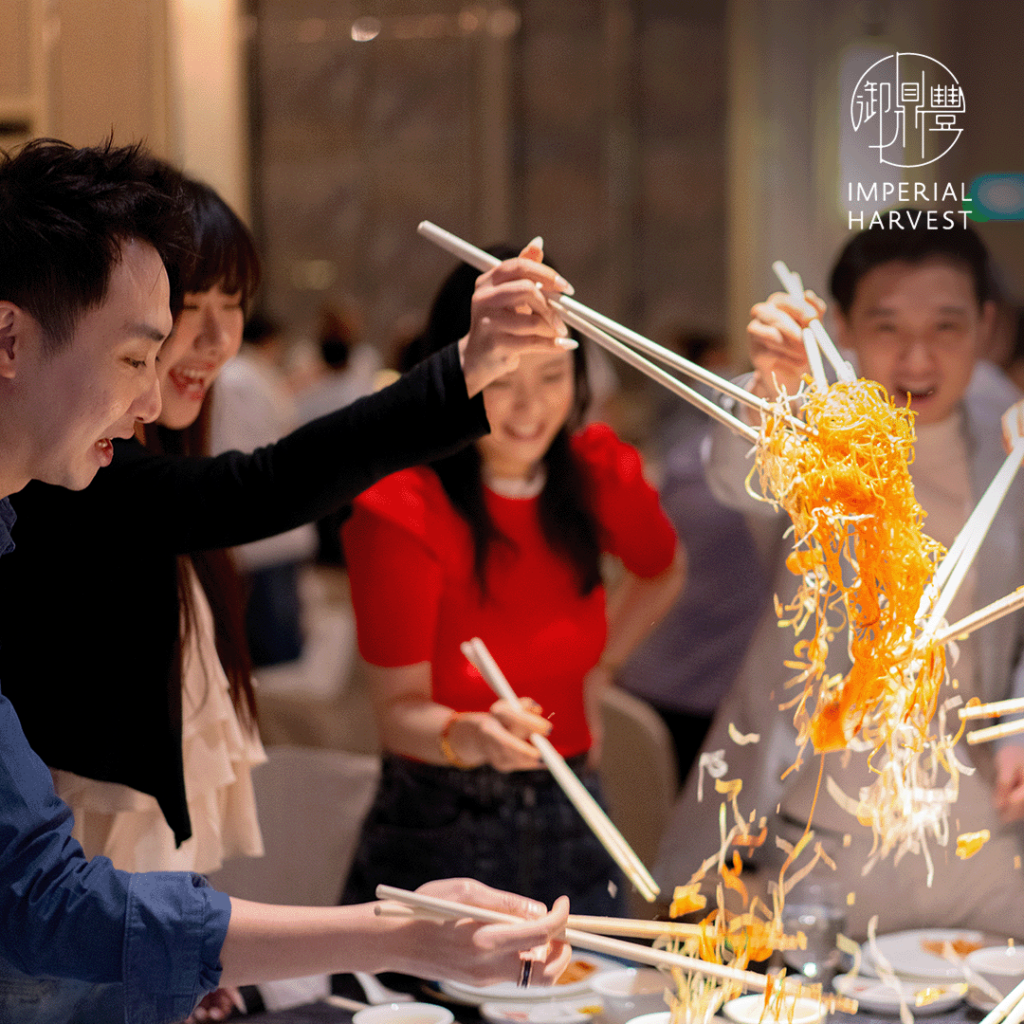 Imperial Harvest guests participating in the lo hei